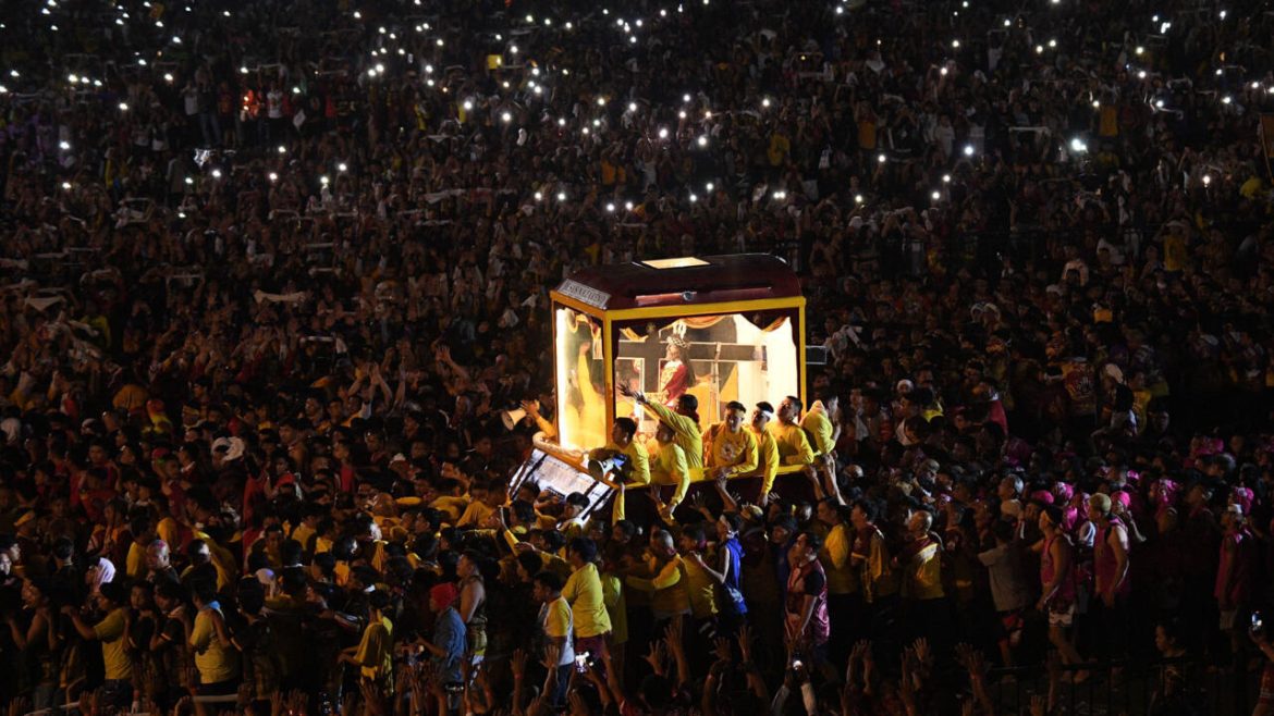 Crowds throng as Jesus statue parades through Philippine capital